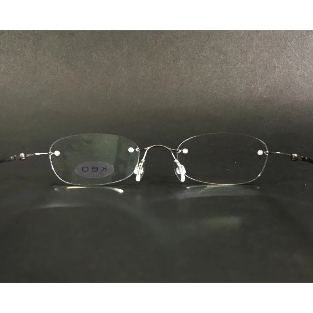 Keo Eyeglasses Frames 107 SGUN Satin Gunmetal Rimless Oval Titanium 47-20-140